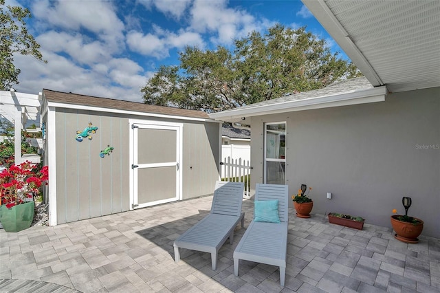 view of patio / terrace with a storage unit