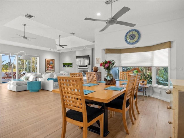 dining space with light hardwood / wood-style flooring