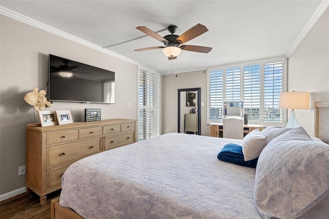 bedroom featuring ceiling fan, crown molding, and dark hardwood / wood-style floors