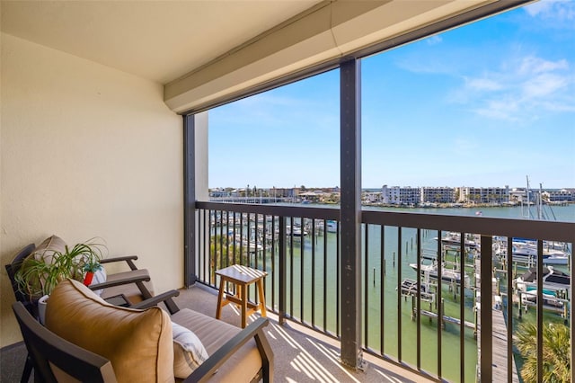 balcony featuring a water view