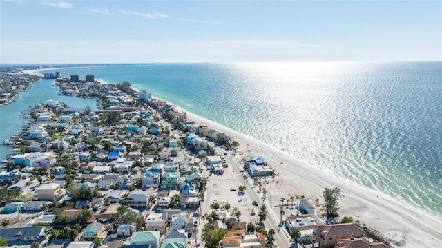 drone / aerial view featuring a water view and a beach view