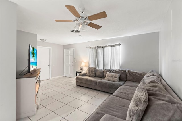 tiled living room featuring ceiling fan