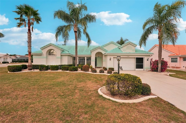 view of front facade with a front lawn and a garage