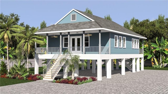 rear view of house featuring ceiling fan, covered porch, and a carport