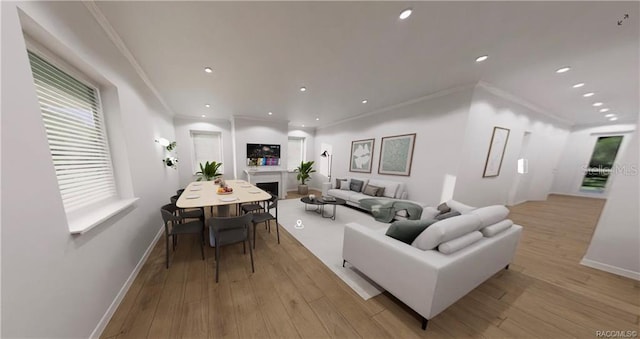 living room featuring light hardwood / wood-style flooring and ornamental molding