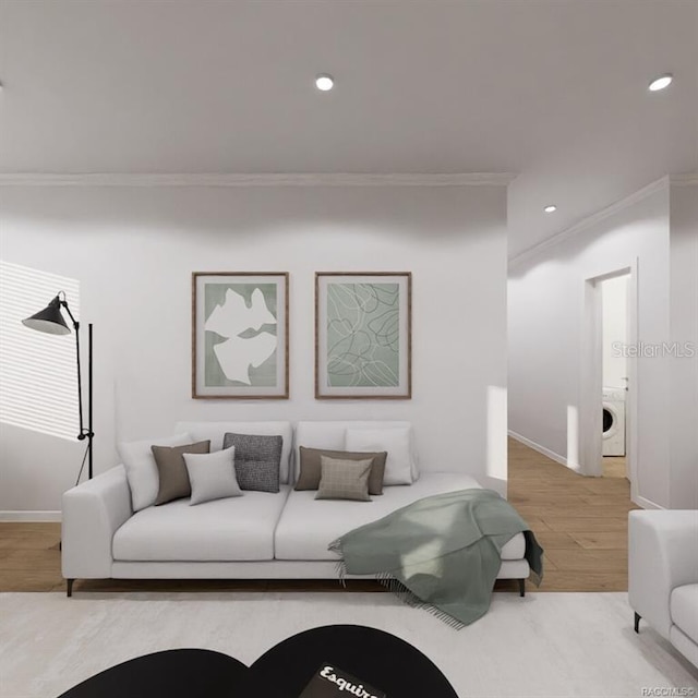 living room with crown molding, light hardwood / wood-style floors, and washer / dryer