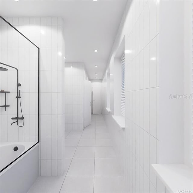 bathroom featuring tile patterned floors and tile walls