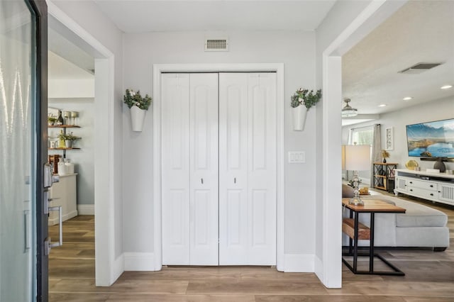 13945 75th Ave, Seminole, FL 33776 - entryway with baseboards, wood finished floors, and recessed lighting