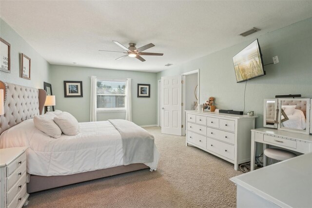 13945 75th Ave, Seminole, FL 33776 - bedroom with light colored carpet and ceiling fan