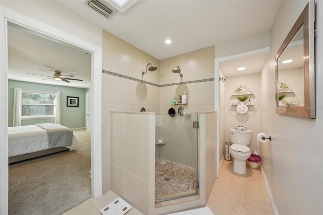 13945 75th Ave, Seminole, FL 33776 - full bathroom featuring a shower stall, toilet, ensuite bath, tile patterned flooring, and baseboards