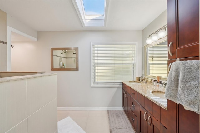 13945 75th Ave, Seminole, FL 33776 - full bath featuring baseboards, double vanity, a walk in shower, a skylight, and tile patterned flooring