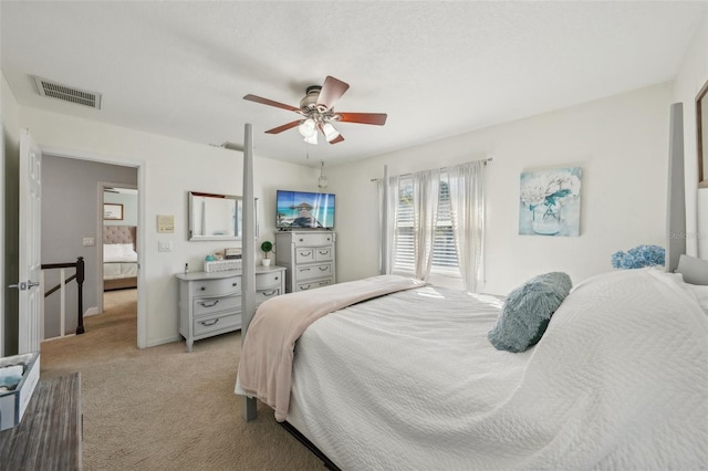 13945 75th Ave, Seminole, FL 33776 - bedroom featuring light colored carpet, ceiling fan, and baseboards