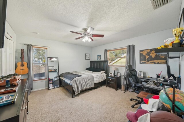 13945 75th Ave, Seminole, FL 33776 - bedroom featuring carpet, an office area, a textured ceiling, and ceiling fan