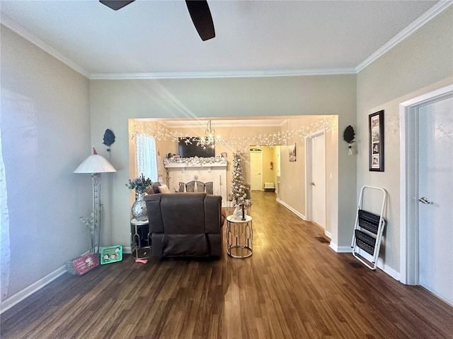 living room featuring hardwood / wood-style flooring, ceiling fan, and ornamental molding