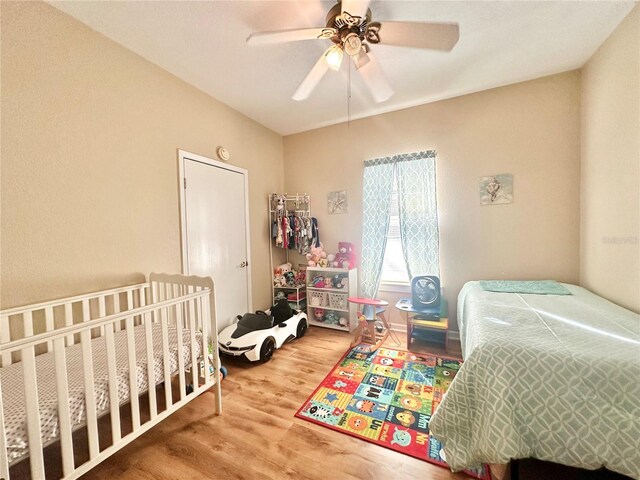 bedroom with ceiling fan and wood-type flooring