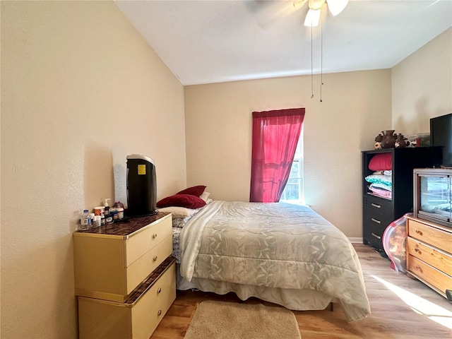 bedroom with ceiling fan and light wood-type flooring