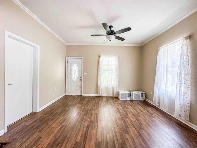 entryway featuring crown molding, ceiling fan, a wall mounted AC, wood finished floors, and baseboards