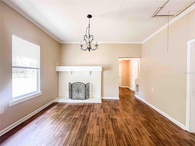 unfurnished living room with crown molding, wood finished floors, and baseboards
