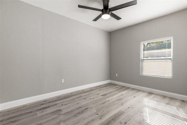 empty room featuring ceiling fan and light hardwood / wood-style floors