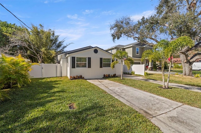 view of front of property with a front lawn