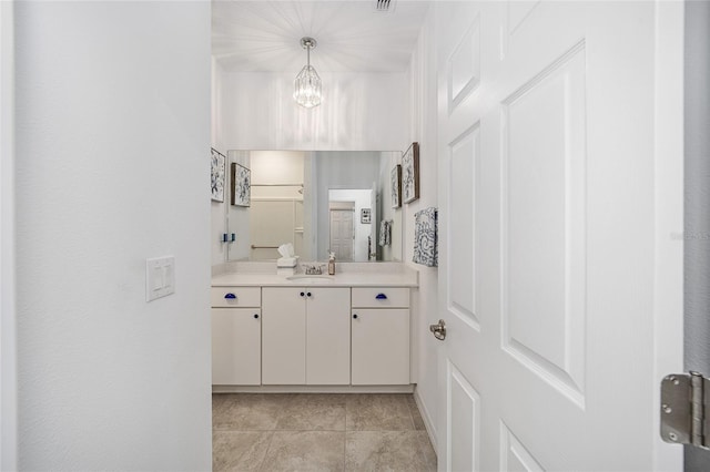 bathroom featuring vanity and a chandelier