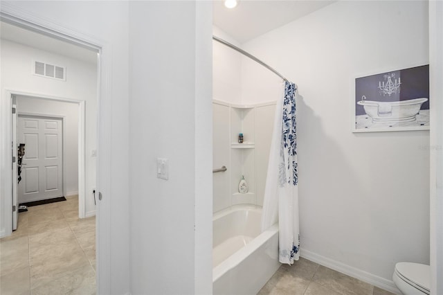 bathroom with tile patterned flooring, toilet, and shower / bath combo with shower curtain