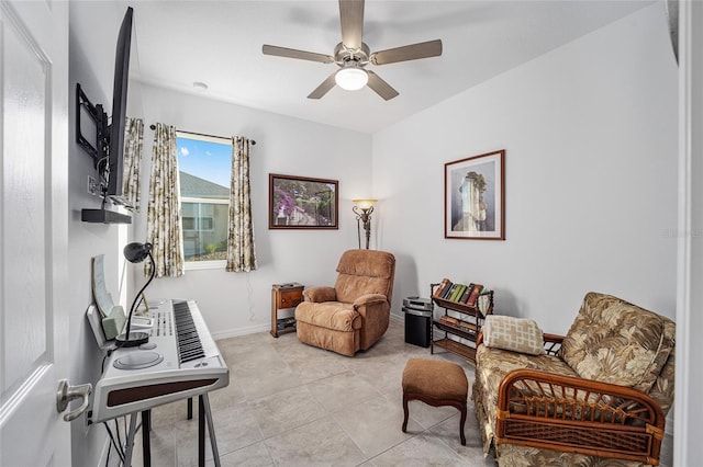 sitting room featuring ceiling fan and light tile patterned floors