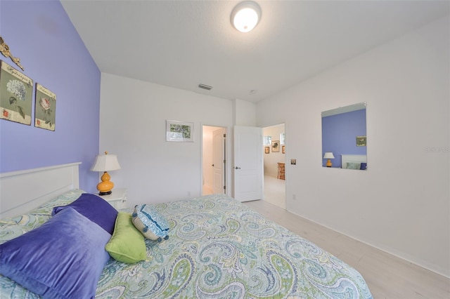 bedroom with light hardwood / wood-style flooring