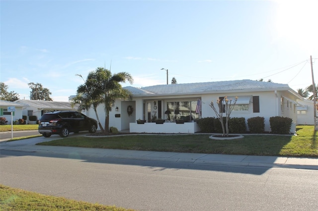 ranch-style house with a front lawn