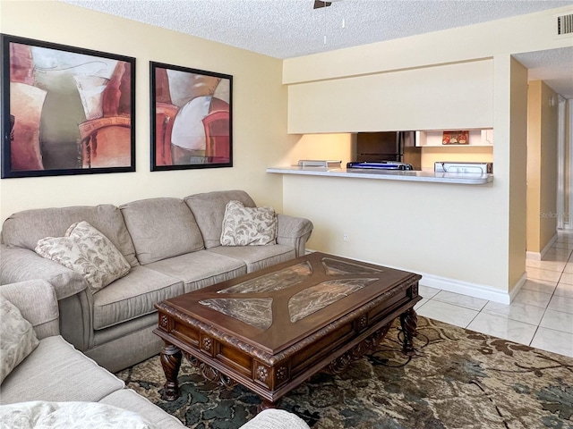 tiled living room with a textured ceiling