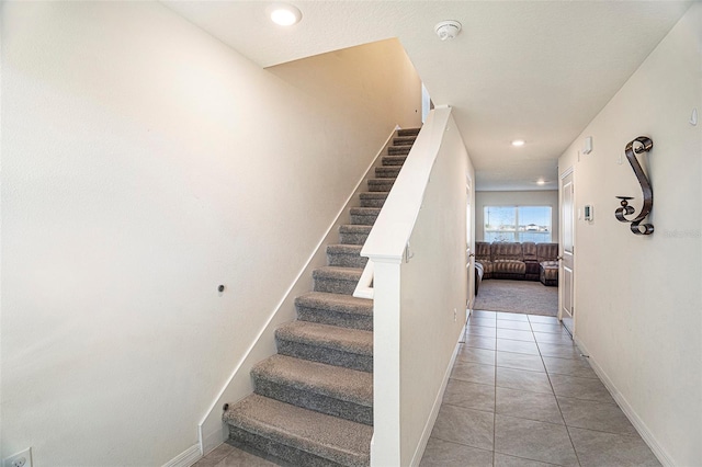 staircase with tile patterned flooring