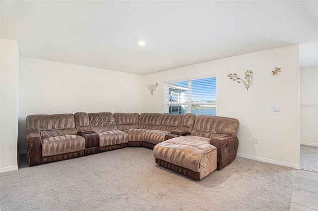 carpeted living room with a water view