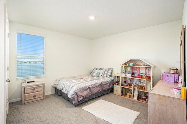 bedroom featuring light colored carpet