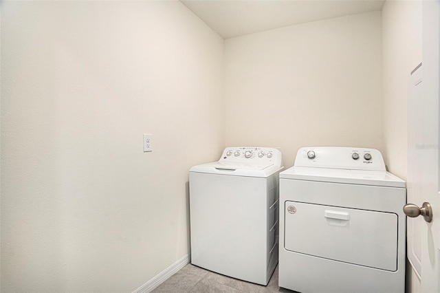 washroom with washer and clothes dryer