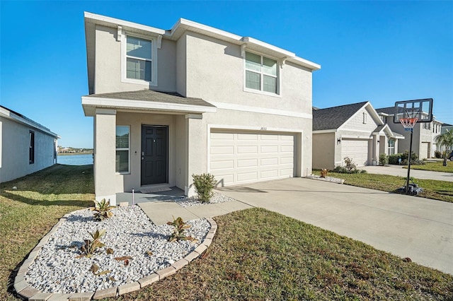 traditional home featuring stucco siding, a shingled roof, an attached garage, driveway, and a front lawn