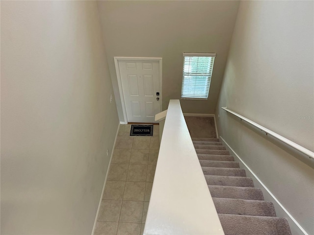 staircase with tile patterned flooring