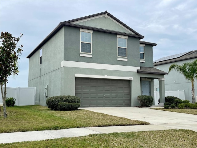 front facade with a garage and a front lawn