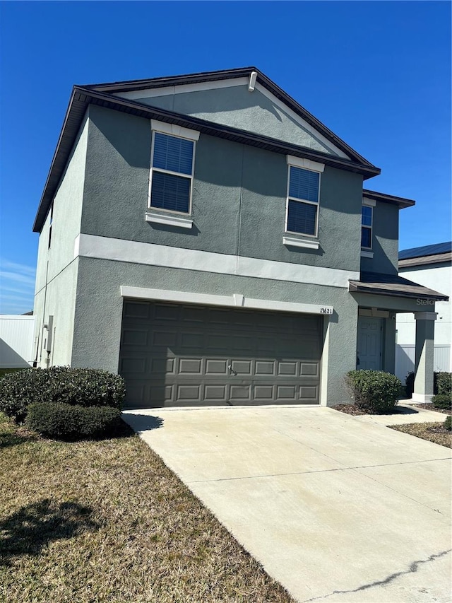 front facade with a garage