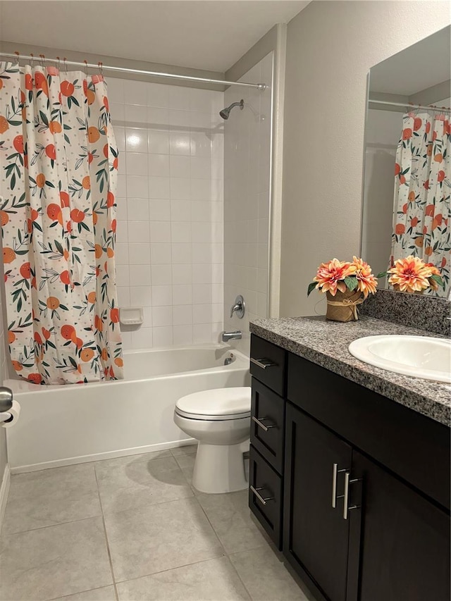 full bathroom featuring vanity, tile patterned flooring, toilet, and shower / bath combo with shower curtain