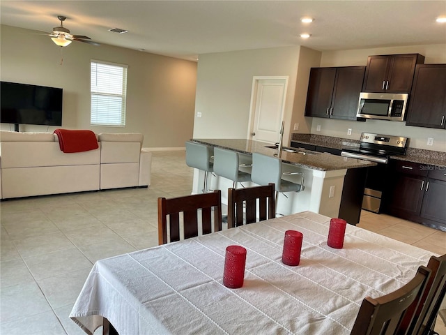 13621 Willow Bluestar Loop, Riverview, FL 33579 - kitchen featuring appliances with stainless steel finishes, open floor plan, light tile patterned floors, and recessed lighting