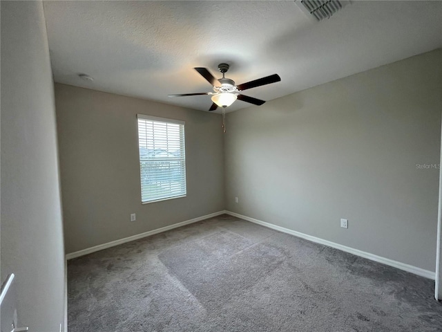 13621 Willow Bluestar Loop, Riverview, FL 33579 - spare room featuring a ceiling fan, carpet floors, a smoke detector, and a textured ceiling