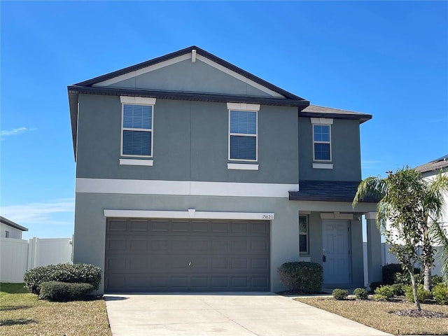 13621 Willow Bluestar Loop, Riverview, FL 33579 - view of front of property featuring stucco siding, concrete driveway, and an attached garage