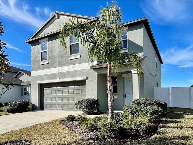 13621 Willow Bluestar Loop, Riverview, FL 33579 - view of front of home featuring an attached garage, stucco siding, and concrete driveway