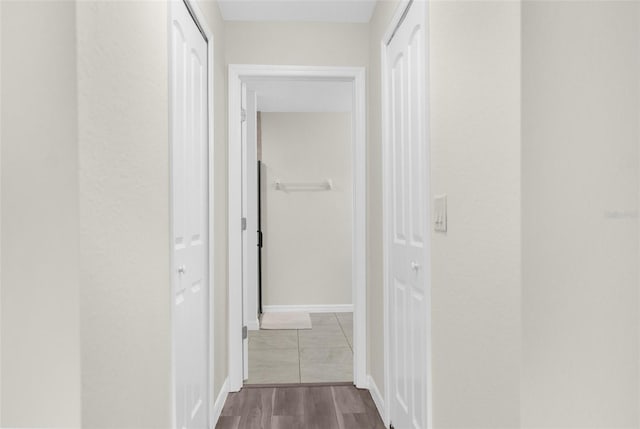 corridor featuring hardwood / wood-style flooring