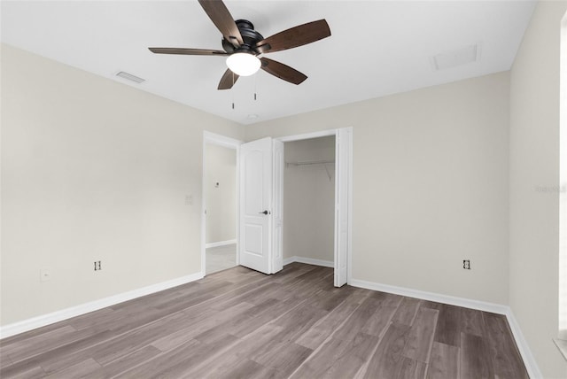 unfurnished bedroom with ceiling fan, a closet, and light hardwood / wood-style floors