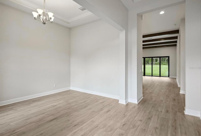 empty room featuring light hardwood / wood-style flooring, beamed ceiling, and a notable chandelier