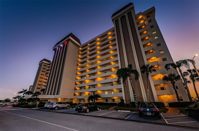 view of outdoor building at dusk