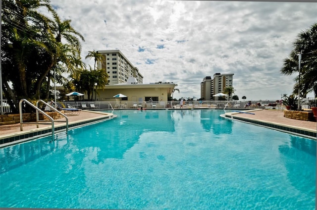 view of swimming pool featuring a patio area