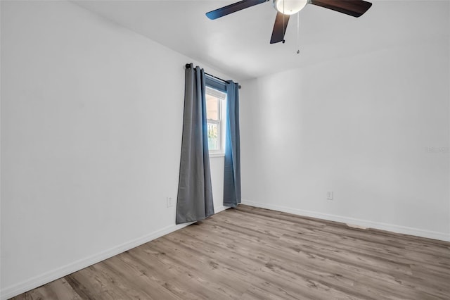 unfurnished room with ceiling fan and light hardwood / wood-style floors