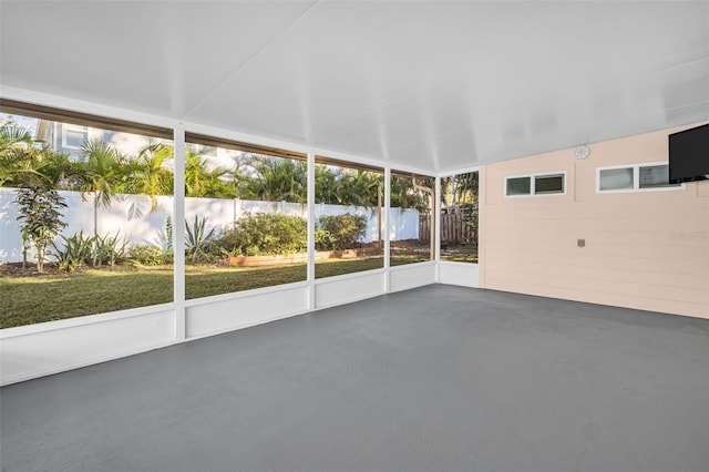 unfurnished sunroom with vaulted ceiling